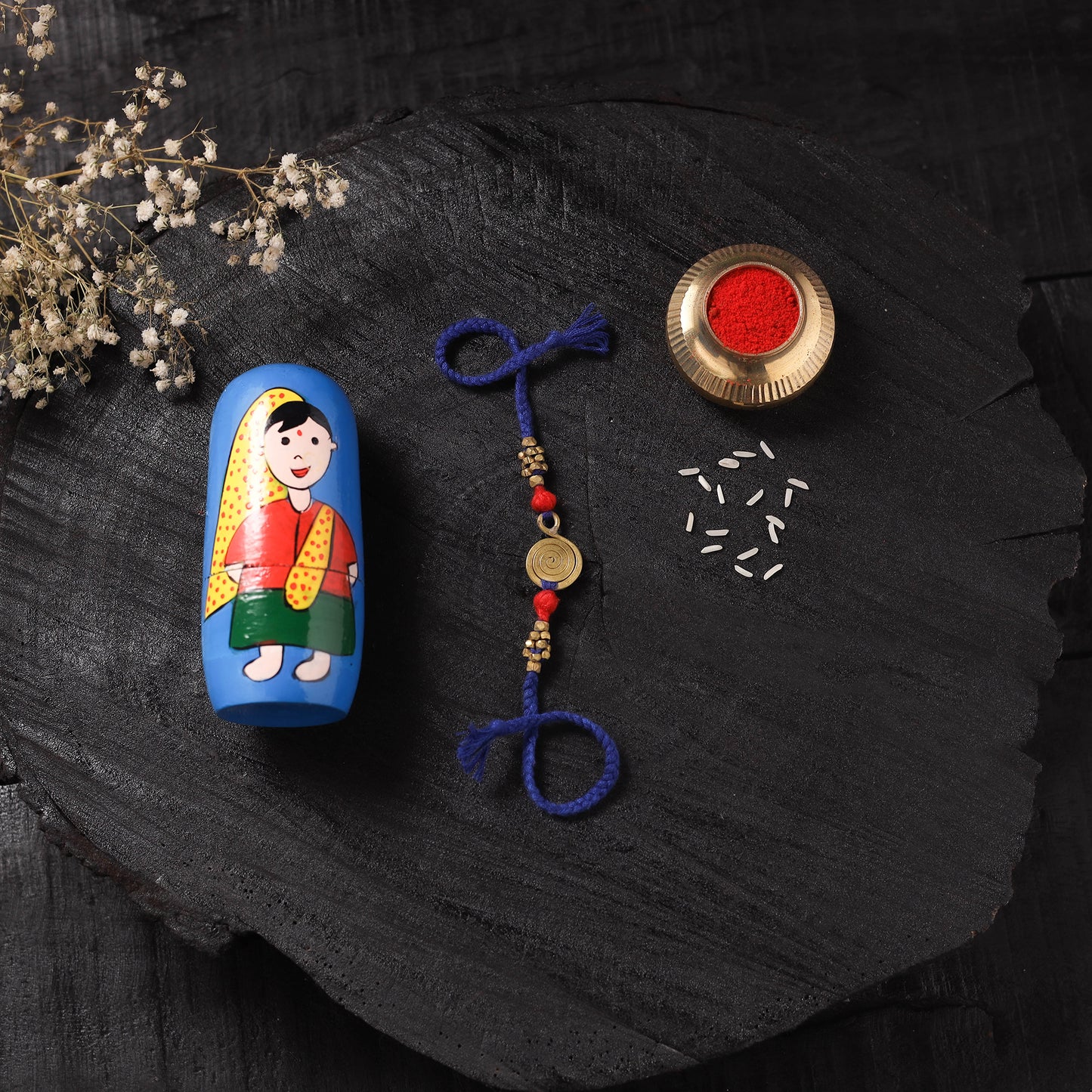 Blue - Handcrafted Tribal Dokra Brass Thread Rakhi with Banaras Wood Doll Box 36
