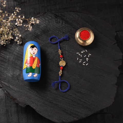 Blue - Handcrafted Tribal Dokra Brass Thread Rakhi with Banaras Wood Doll Box 36