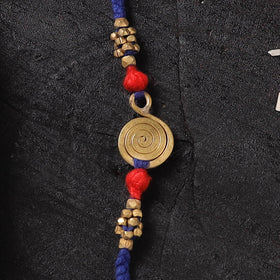 Blue - Handcrafted Tribal Dokra Brass Thread Rakhi with Banaras Wood Doll Box 36