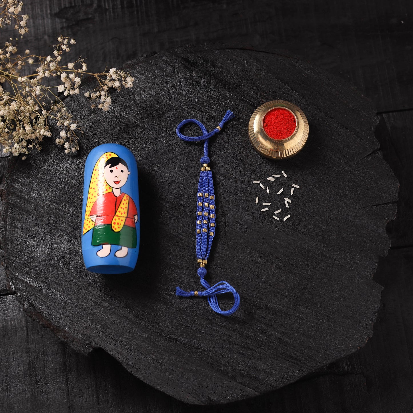 Blue - Handcrafted Tribal Dokra Brass Thread Rakhi with Banaras Wood Doll Box 37