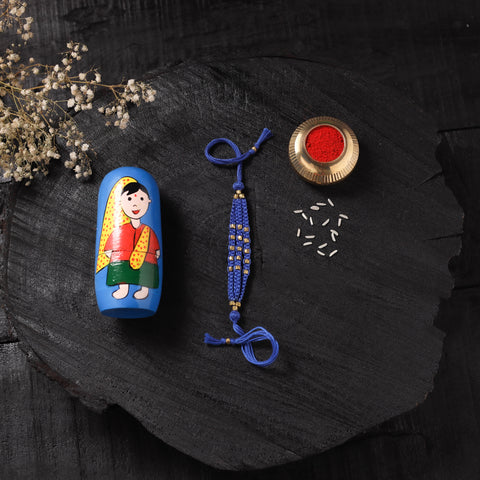 Blue - Handcrafted Tribal Dokra Brass Thread Rakhi with Banaras Wood Doll Box 37