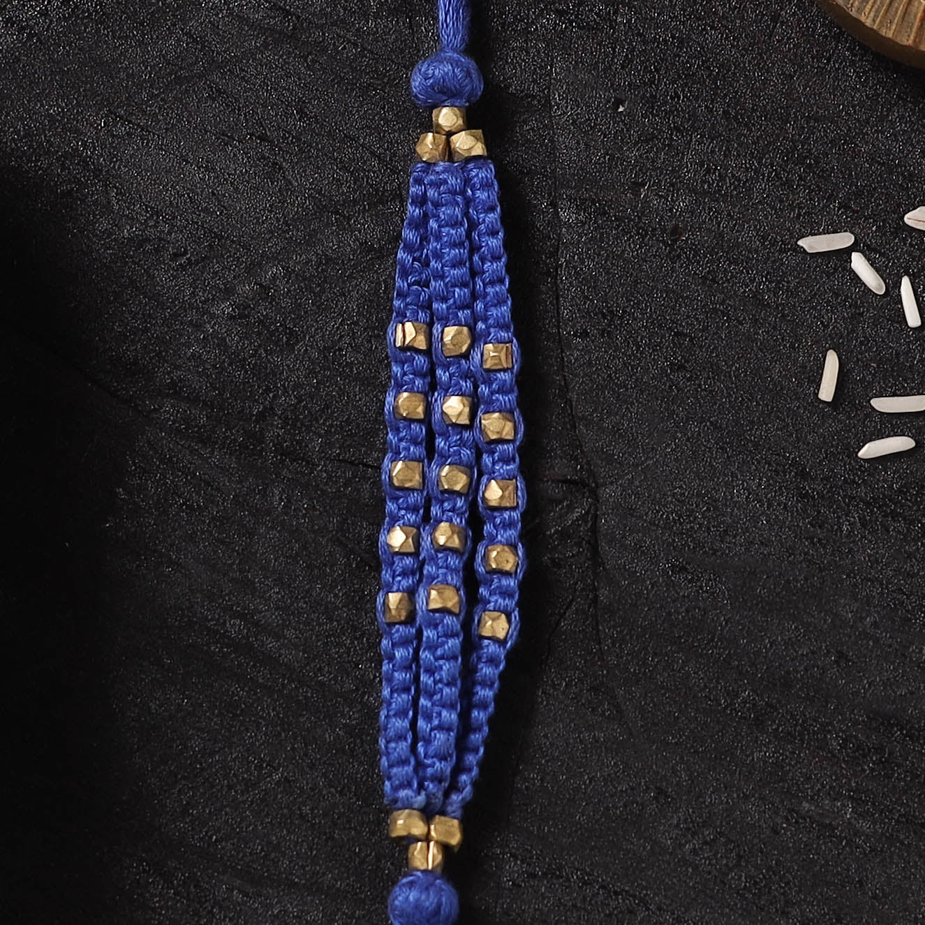 Blue - Handcrafted Tribal Dokra Brass Thread Rakhi with Banaras Wood Doll Box 37