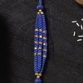 Blue - Handcrafted Tribal Dokra Brass Thread Rakhi with Banaras Wood Doll Box 37