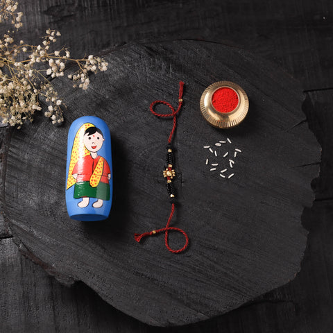 Red - Handcrafted Tribal Dokra Brass Thread Rakhi with Banaras Wood Doll Box 38