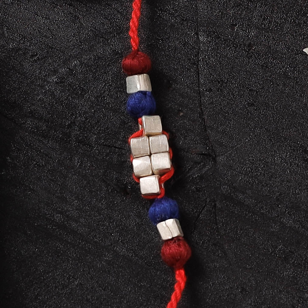 Red - Handcrafted Tribal Dokra Brass Thread Rakhi with Banaras Wood Doll Box 40