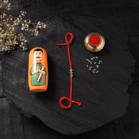 Red - Handcrafted Tribal Dokra Brass Thread Rakhi with Banaras Wood Doll Box 42