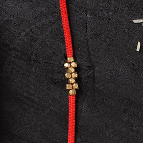 Red - Handcrafted Tribal Dokra Brass Thread Rakhi with Banaras Wood Doll Box 42