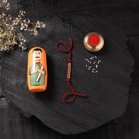 Red - Handcrafted Tribal Dokra Brass Thread Rakhi with Banaras Wood Doll Box 43