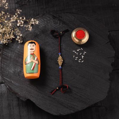 Red - Handcrafted Tribal Dokra Brass Thread Rakhi with Banaras Wood Doll Box 44
