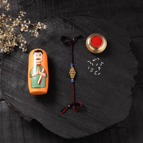Red - Handcrafted Tribal Dokra Brass Thread Rakhi with Banaras Wood Doll Box 44