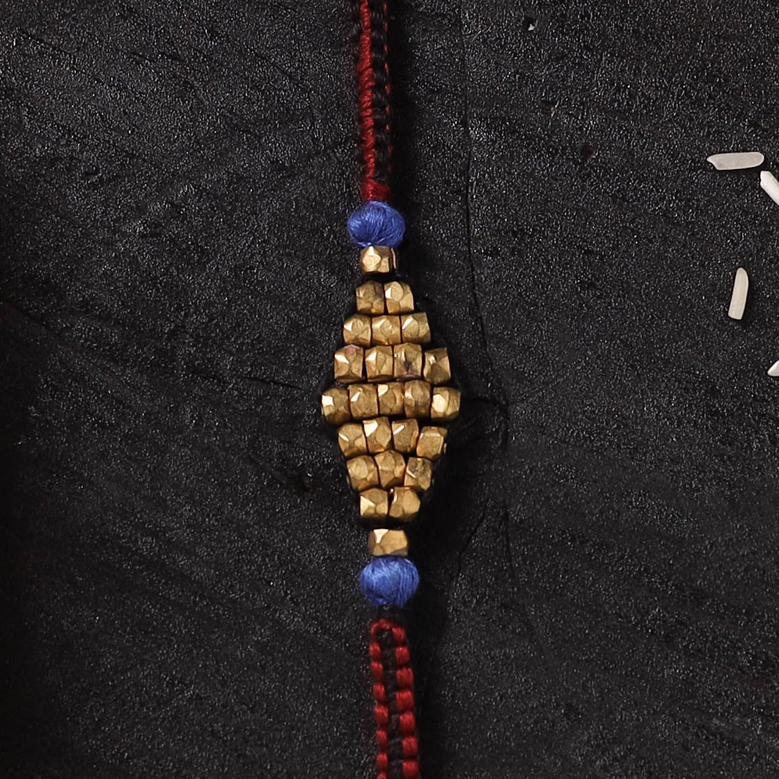 Red - Handcrafted Tribal Dokra Brass Thread Rakhi with Banaras Wood Doll Box 44