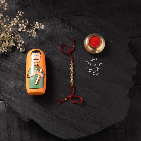 Red - Handcrafted Tribal Dokra Brass Thread Rakhi with Banaras Wood Doll Box 45