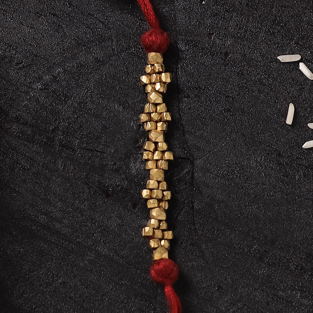 Red - Handcrafted Tribal Dokra Brass Thread Rakhi with Banaras Wood Doll Box 45