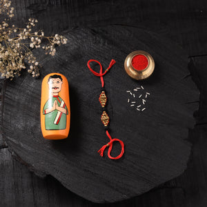 Red - Handcrafted Tribal Dokra Brass Thread Rakhi with Banaras Wood Doll Box 46