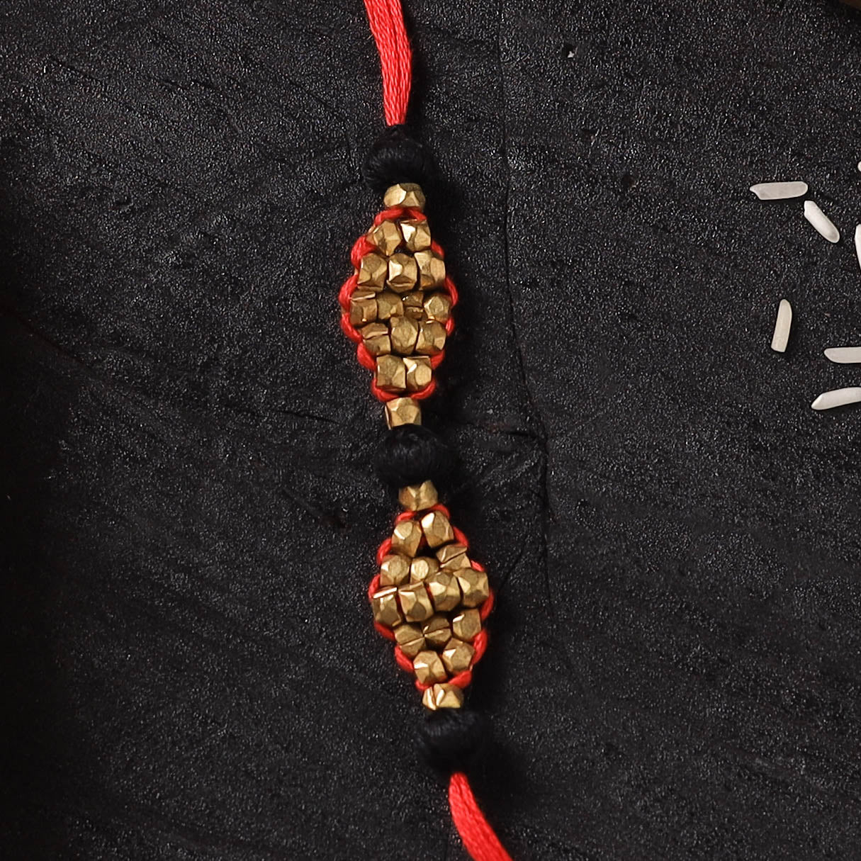Red - Handcrafted Tribal Dokra Brass Thread Rakhi with Banaras Wood Doll Box 46