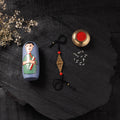Black - Handcrafted Tribal Dokra Brass Thread Rakhi with Banaras Wood Doll Box 49