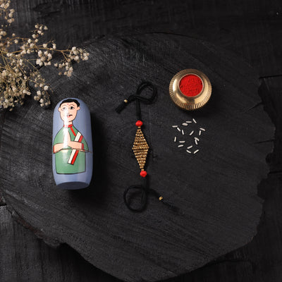 Black - Handcrafted Tribal Dokra Brass Thread Rakhi with Banaras Wood Doll Box 49
