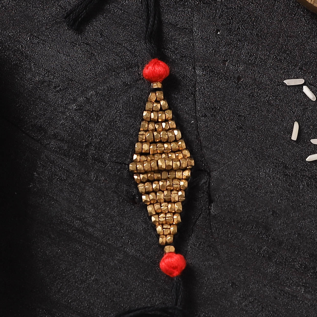 Black - Handcrafted Tribal Dokra Brass Thread Rakhi with Banaras Wood Doll Box 49