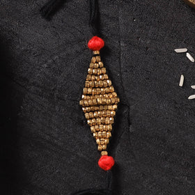 Black - Handcrafted Tribal Dokra Brass Thread Rakhi with Banaras Wood Doll Box 49