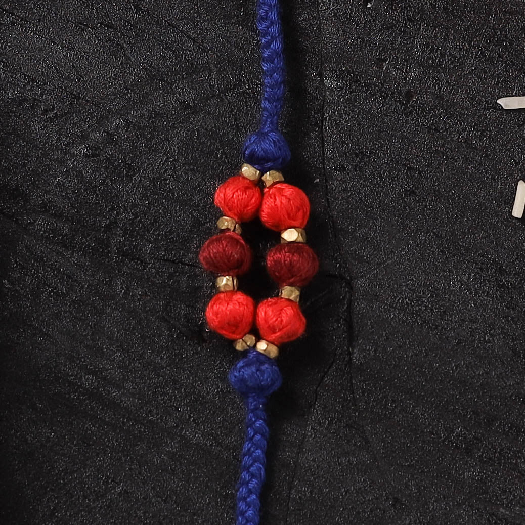 Blue - Handcrafted Tribal Dokra Brass Thread Rakhi with Banaras Wood Doll Box 50