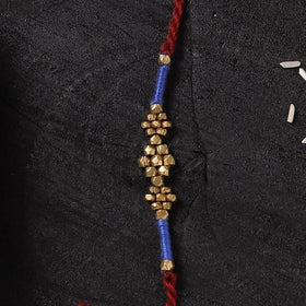 Red - Handcrafted Tribal Dokra Brass Thread Rakhi with Banaras Wood Doll Box 51