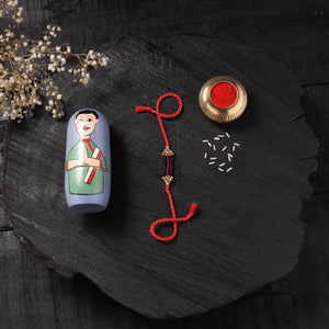 Red - Handcrafted Tribal Dokra Brass Thread Rakhi with Banaras Wood Doll Box 52