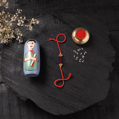 Red - Handcrafted Tribal Dokra Brass Thread Rakhi with Banaras Wood Doll Box 52