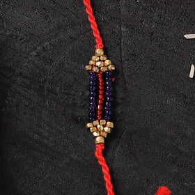 Red - Handcrafted Tribal Dokra Brass Thread Rakhi with Banaras Wood Doll Box 52