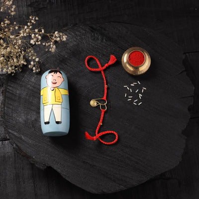 Red - Handcrafted Tribal Dokra Brass Thread Rakhi with Banaras Wood Doll Box 55