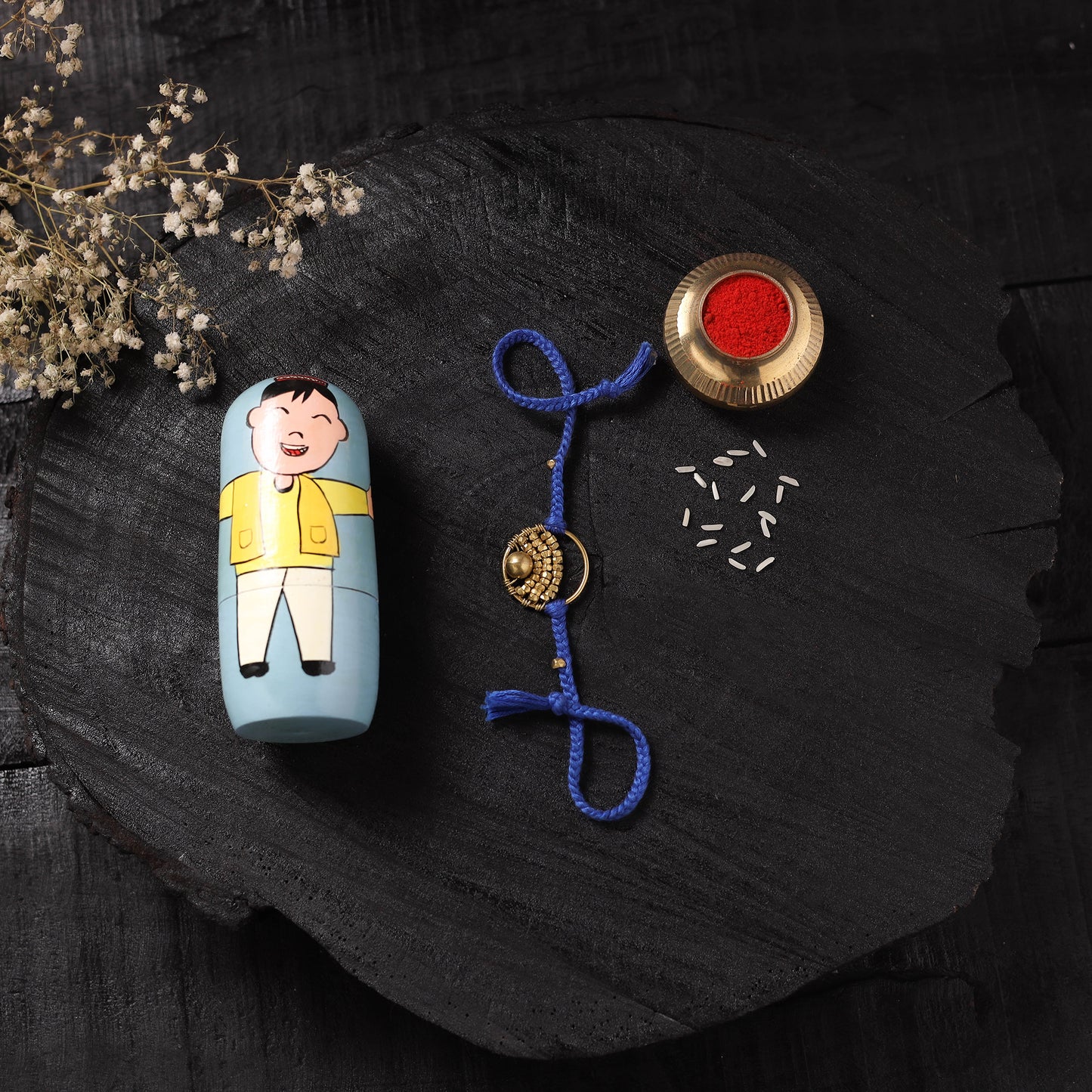 Blue - Handcrafted Tribal Dokra Brass Thread Rakhi with Banaras Wood Doll Box 56