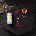 Red - Handcrafted Tribal Dokra Brass Thread Rakhi with Banaras Wood Doll Box 57