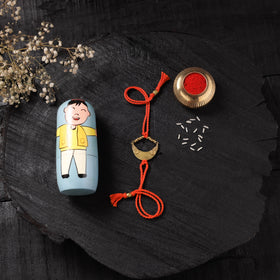 Red - Handcrafted Tribal Dokra Brass Thread Rakhi with Banaras Wood Doll Box 59
