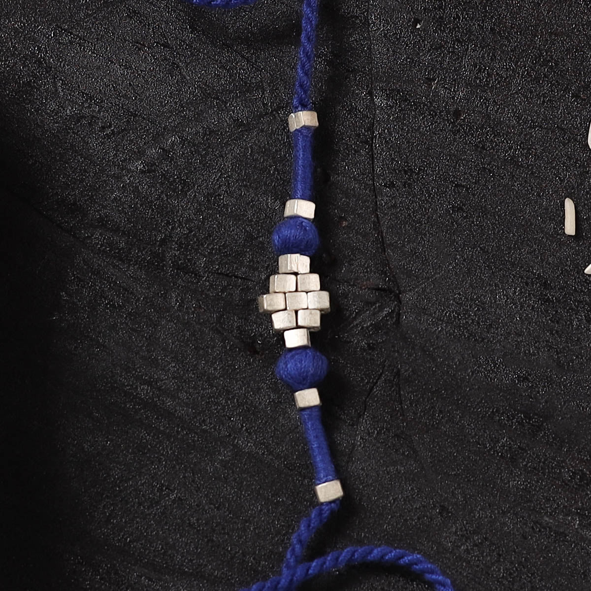 Blue - Handcrafted Tribal Dokra Brass Thread Rakhi with Banaras Wood Doll Box 61