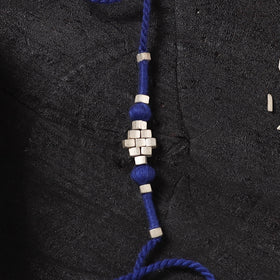 Blue - Handcrafted Tribal Dokra Brass Thread Rakhi with Banaras Wood Doll Box 61