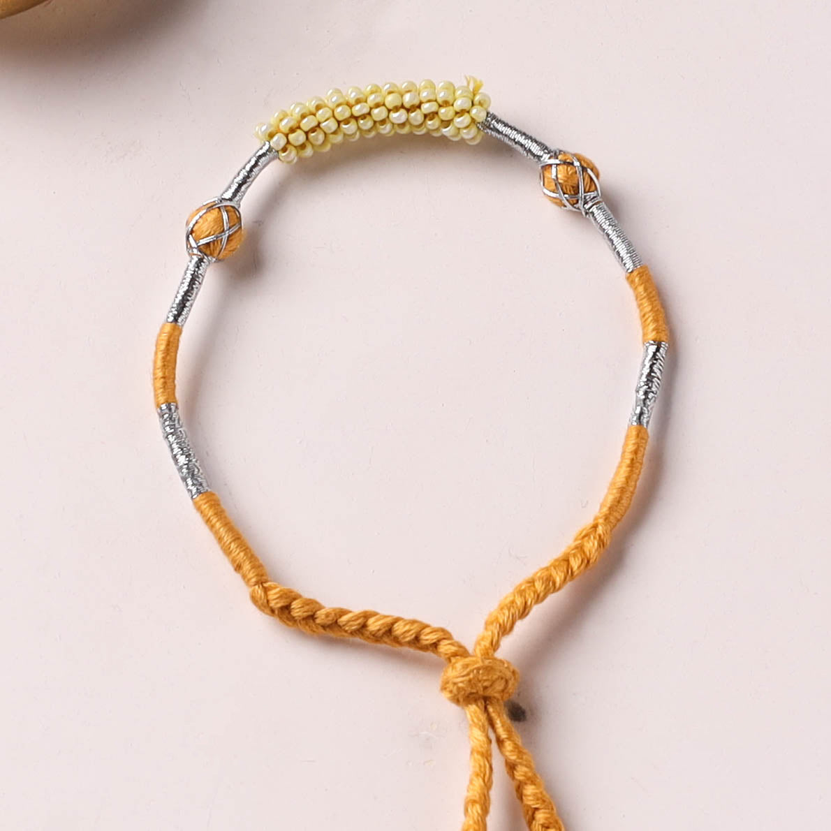 Anant Raksha Thread & Bead Work Lumba Rakhi / Bracelet with Potli 09