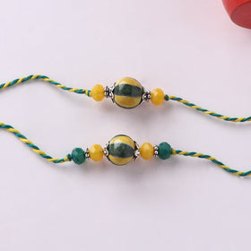Yellow - Handmade Blue Pottery & GS Bead Work Bhaiya Bhabhi Rakhi Set with Banaras Wood Dolls Box 20
