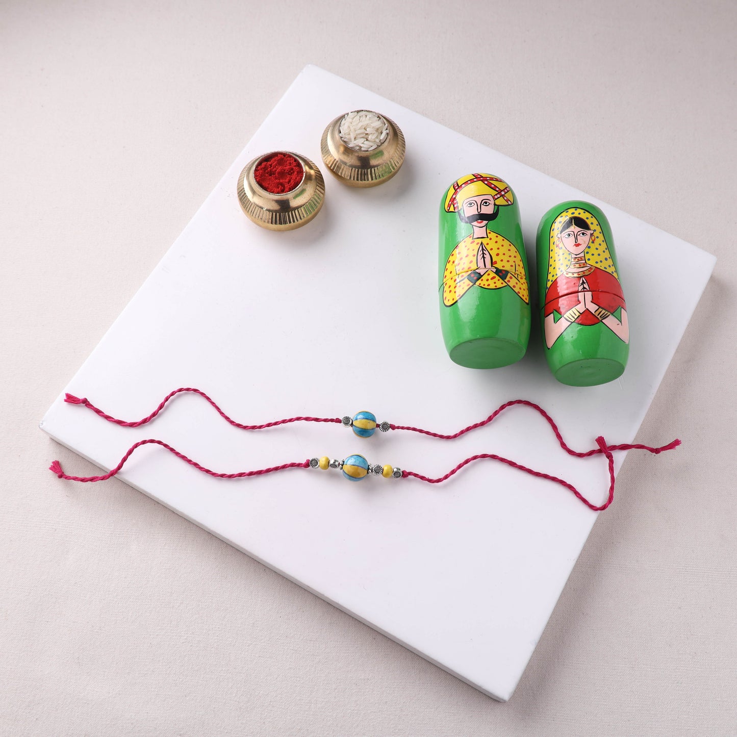 Yellow - Handmade Blue Pottery & GS Bead Work Bhaiya Bhabhi Rakhi Set with Banaras Wood Dolls Box 21