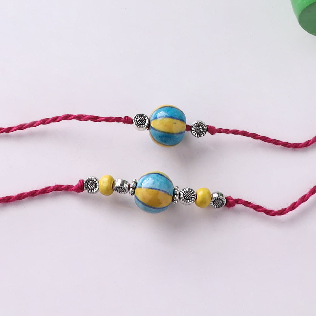 Yellow - Handmade Blue Pottery & GS Bead Work Bhaiya Bhabhi Rakhi Set with Banaras Wood Dolls Box 21