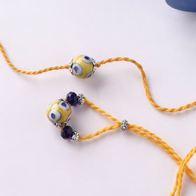 Yellow - Handmade Blue Pottery & GS Bead Work Bhaiya Bhabhi Rakhi Set with Banaras Wood Dolls Box 23