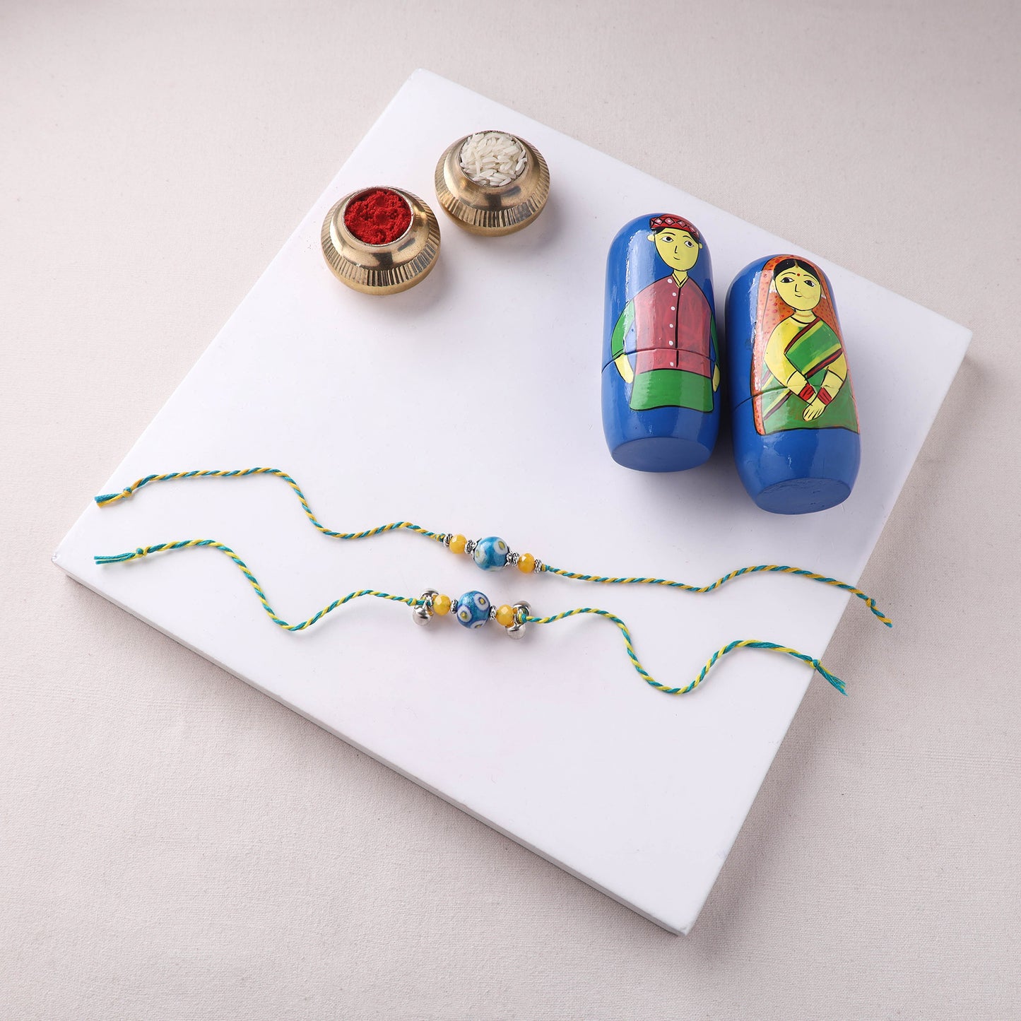 Blue - Handmade Blue Pottery & GS Bead Work Bhaiya Bhabhi Rakhi Set with Banaras Wood Dolls Box 24