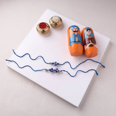Blue - Pearls Handmade Blue Pottery & GS Bead Work Bhaiya Bhabhi Rakhi Set with Banaras Wood Dolls Box 26