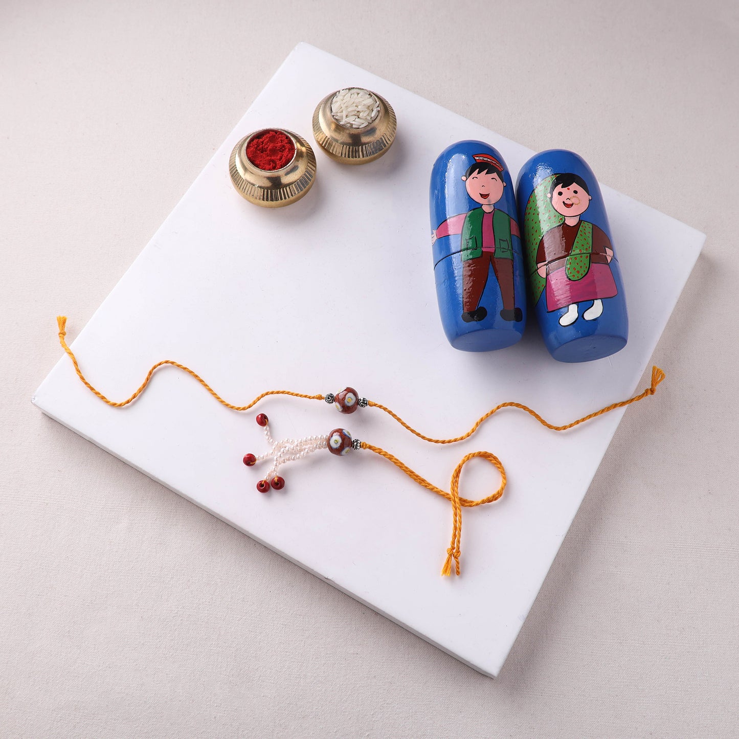 Red - Handmade Blue Pottery & GS Bead Work Rakhi Lumba Set with Banaras Wood Dolls Box 30