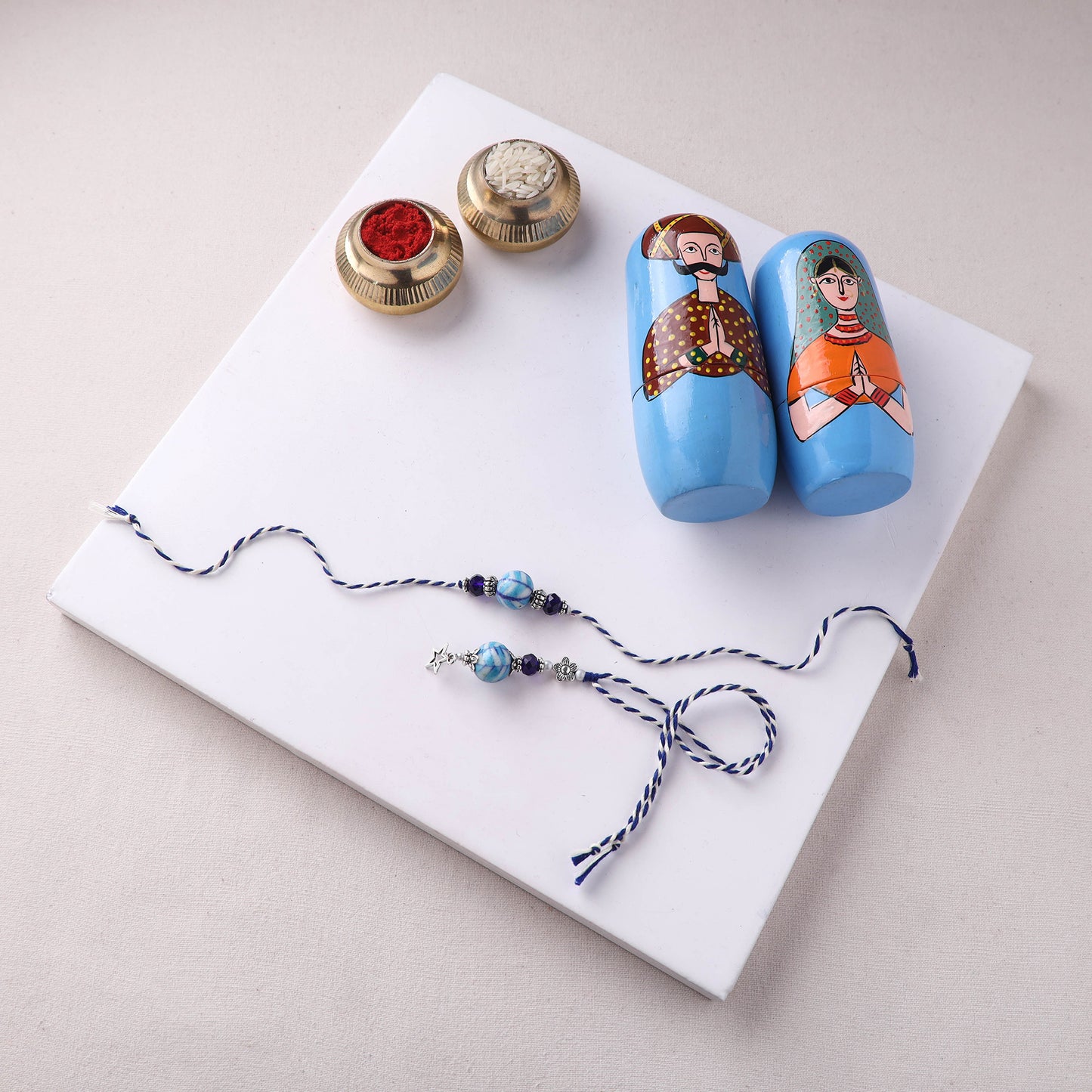 Blue - Handmade Blue Pottery & GS Bead Work Rakhi Lumba Set with Banaras Wood Dolls Box 33