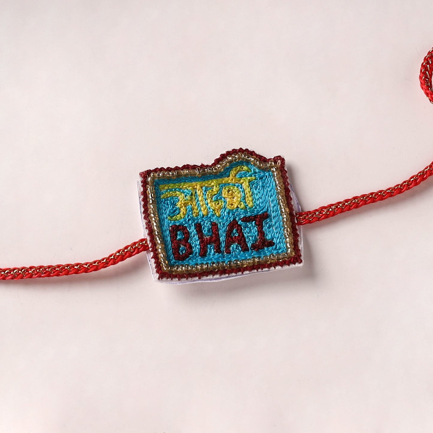 Sis - Reusable Handmade Thread & Beadwork Rakhi with Potli By Jugni 14