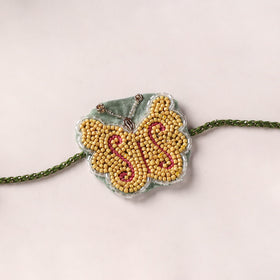 Butterfly - Reusable Handmade Thread & Beadwork Rakhi with Potli By Jugni 07