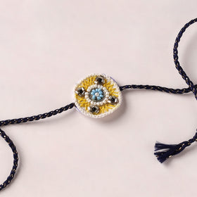 Flower - Reusable Handmade Thread & Beadwork Rakhi with Potli By Jugni 10