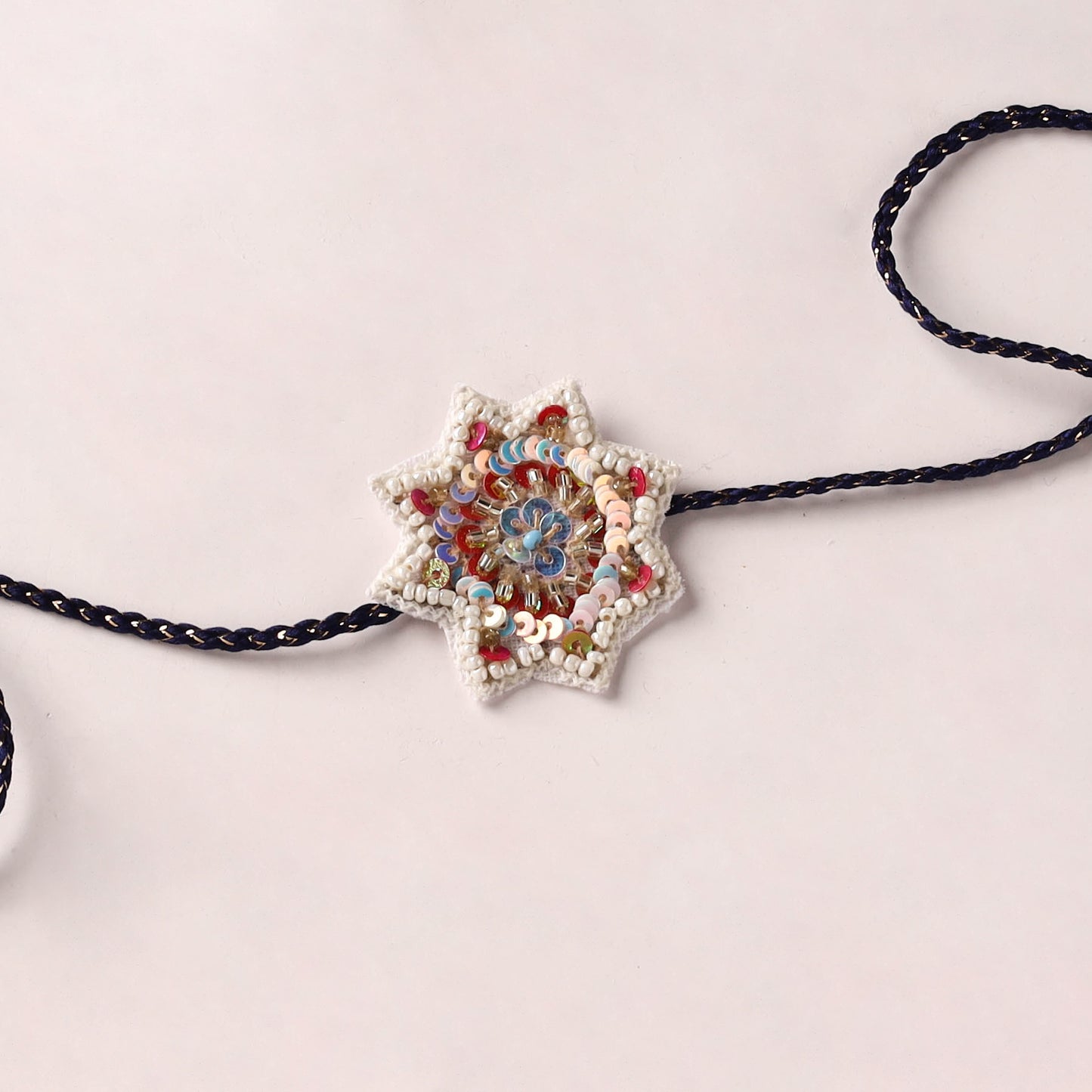 Flower - Reusable Handmade Thread & Beadwork Rakhi with Potli By Jugni 11