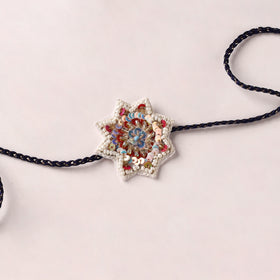Flower - Reusable Handmade Thread & Beadwork Rakhi with Potli By Jugni 11