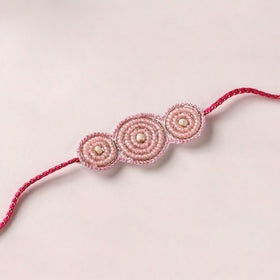 Reusable Handmade Thread & Beadwork Rakhi with Potli By Jugni 15