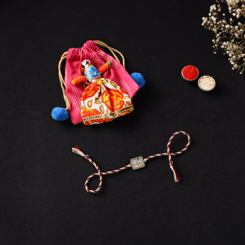 Handcrafted Kundan Rakhi for Brother with Potli 01